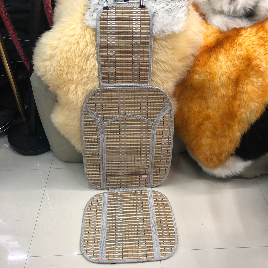 A pair of bamboo woven car seat cushions in summer beige