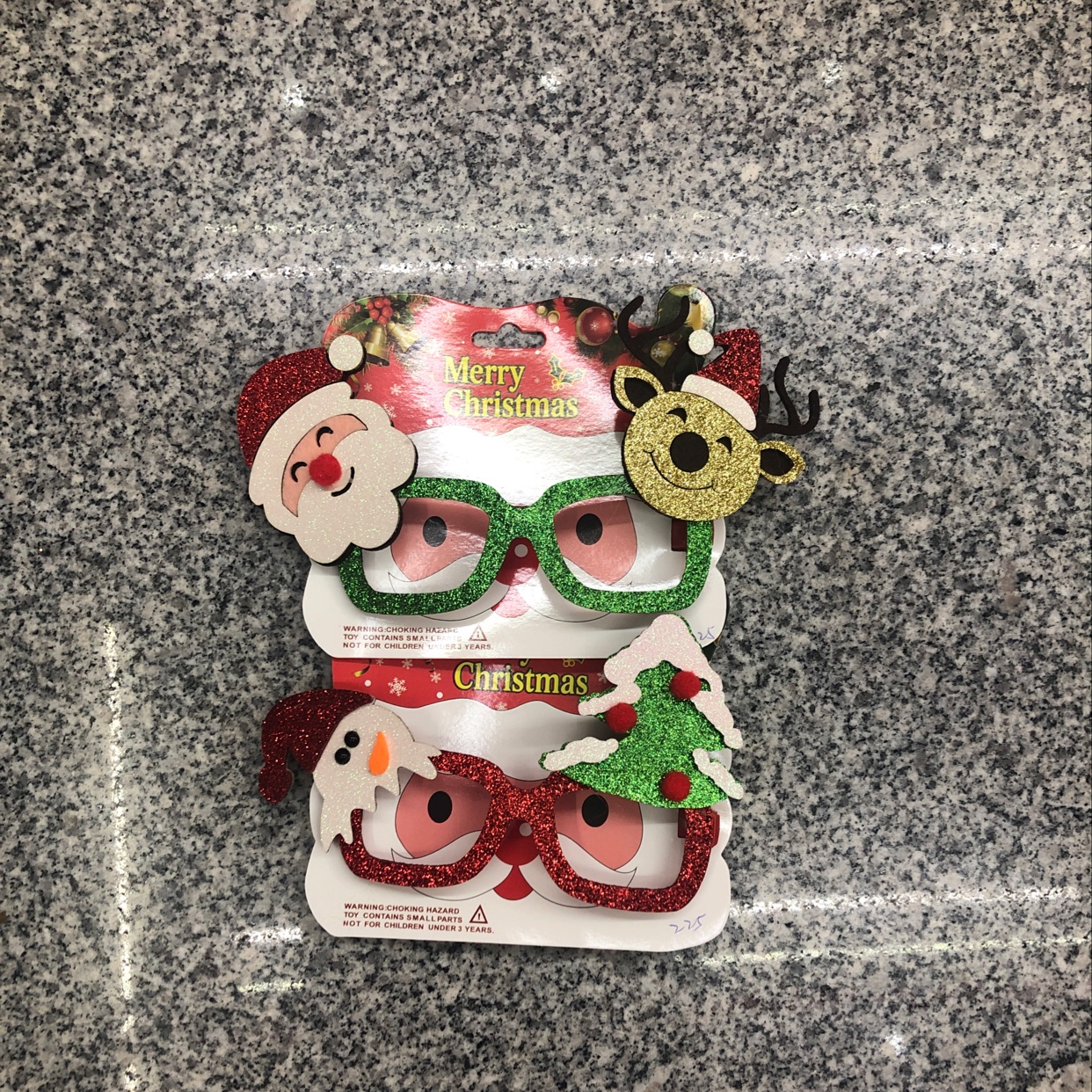 Christmas glasses, bright pink Santa Claus and deer, snowman and Christmas tree details Picture