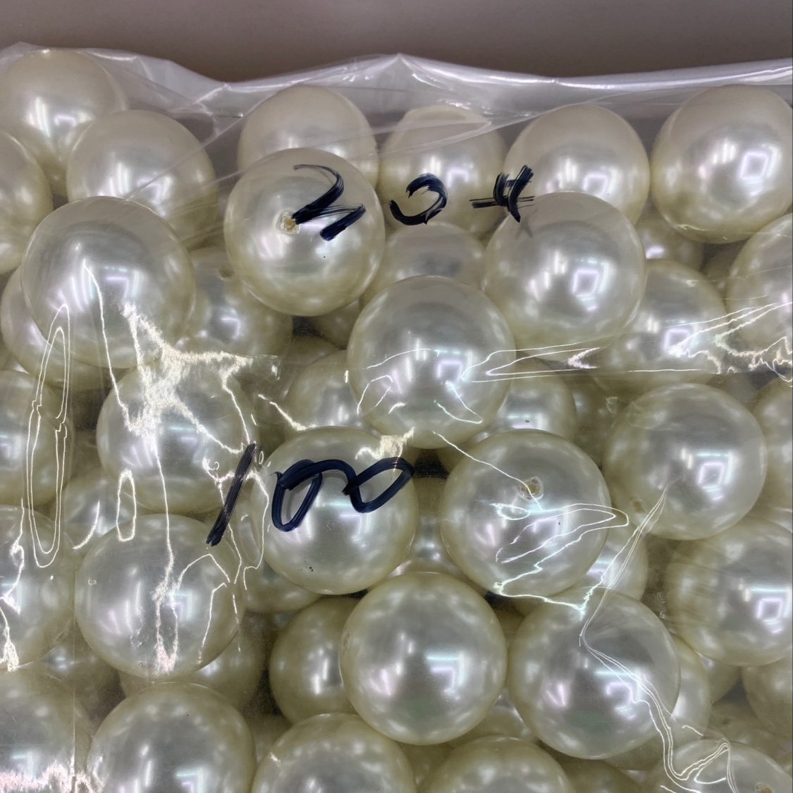 30 half-hole beige pearls