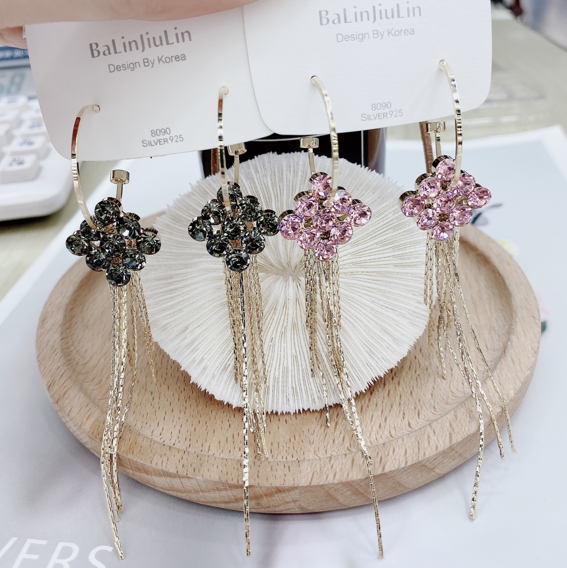 The long style with fully diamond-encrusted tassels is versatile