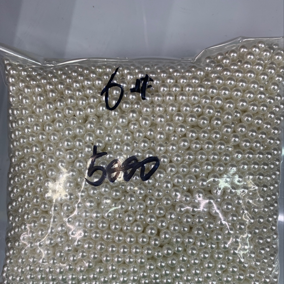 6 white pearls without pores
