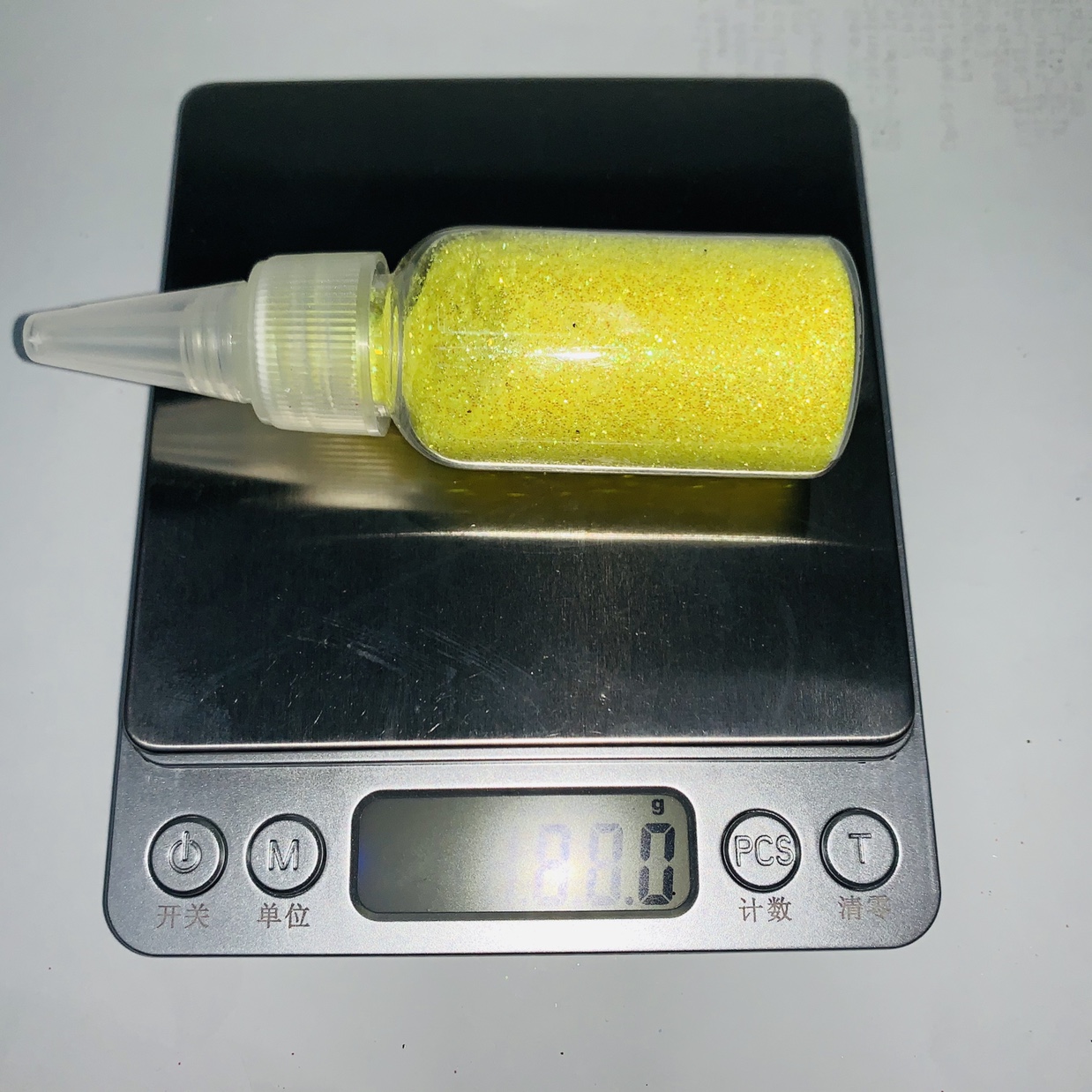 The pointed lid is covered with colored powder undefined