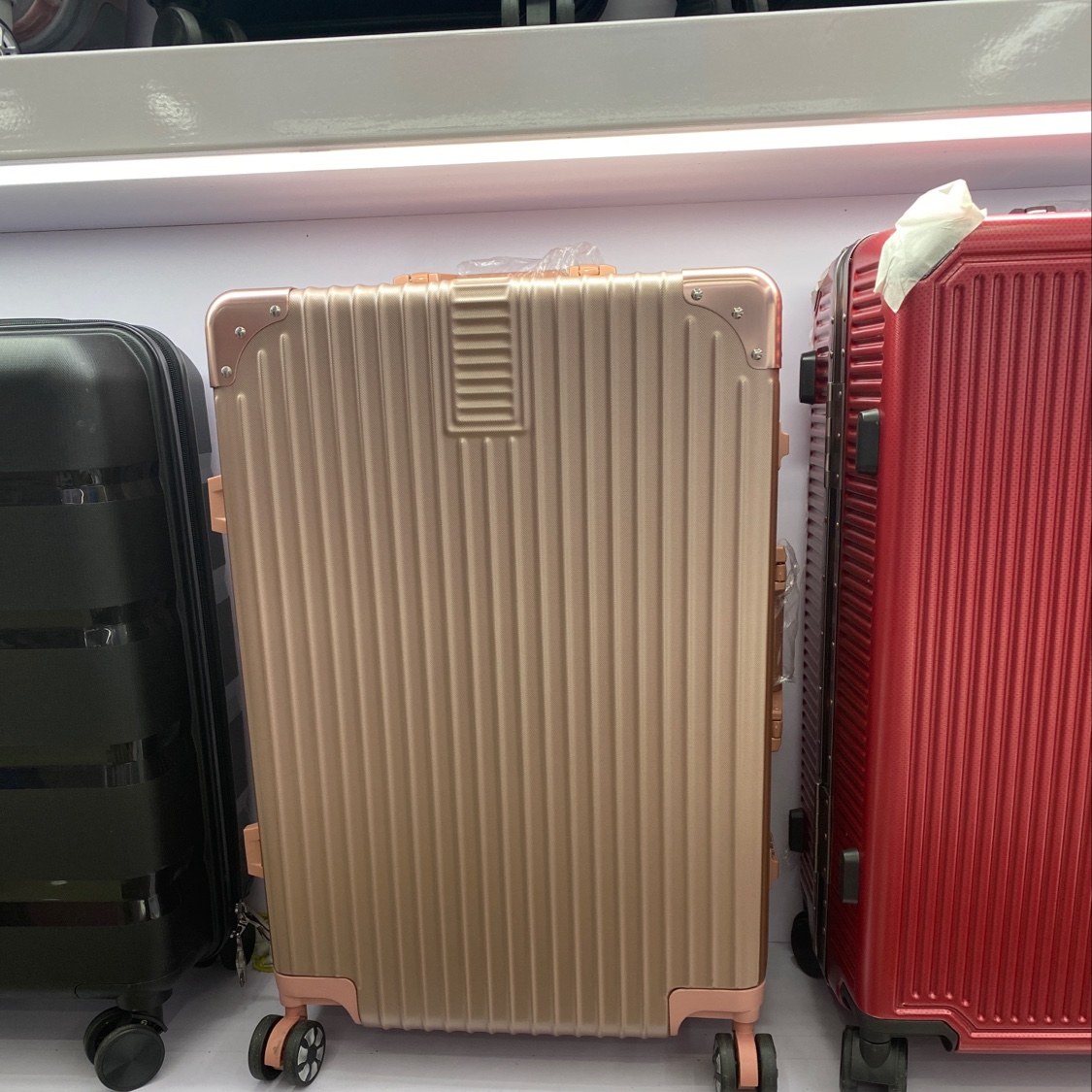 铝框玫瑰金24寸Abs材质旅游上学必备拉杆箱旅行箱