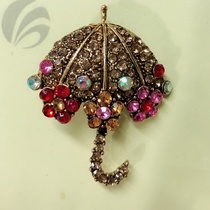 Antique gold, antique silver, umbrella rhinestone brooch from 240