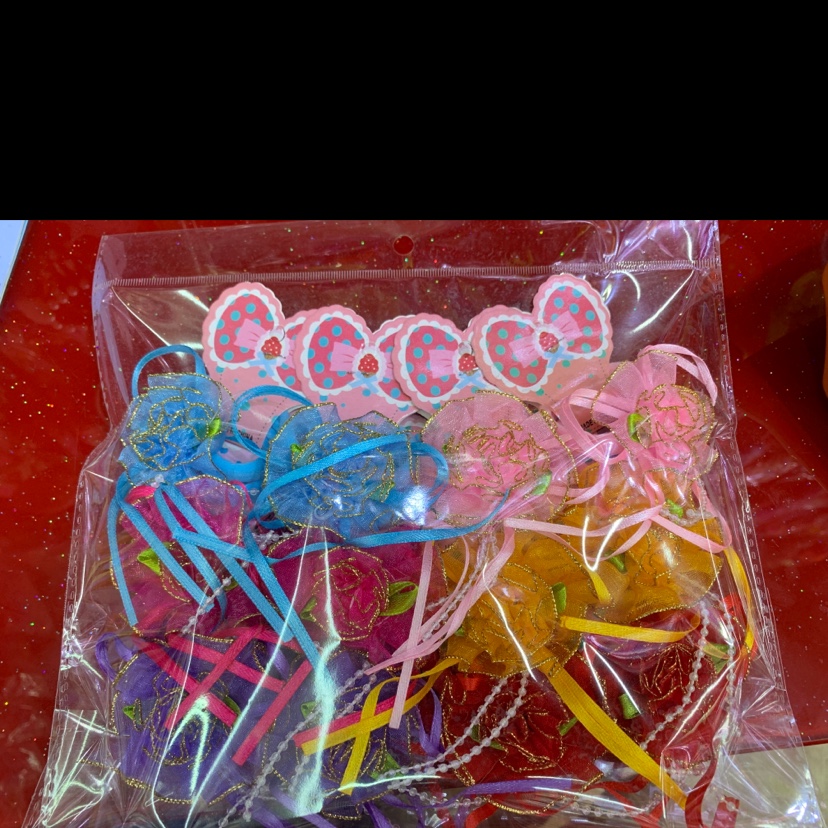 Rubber bands, gold and gold ribbons, flowers thumbnail
