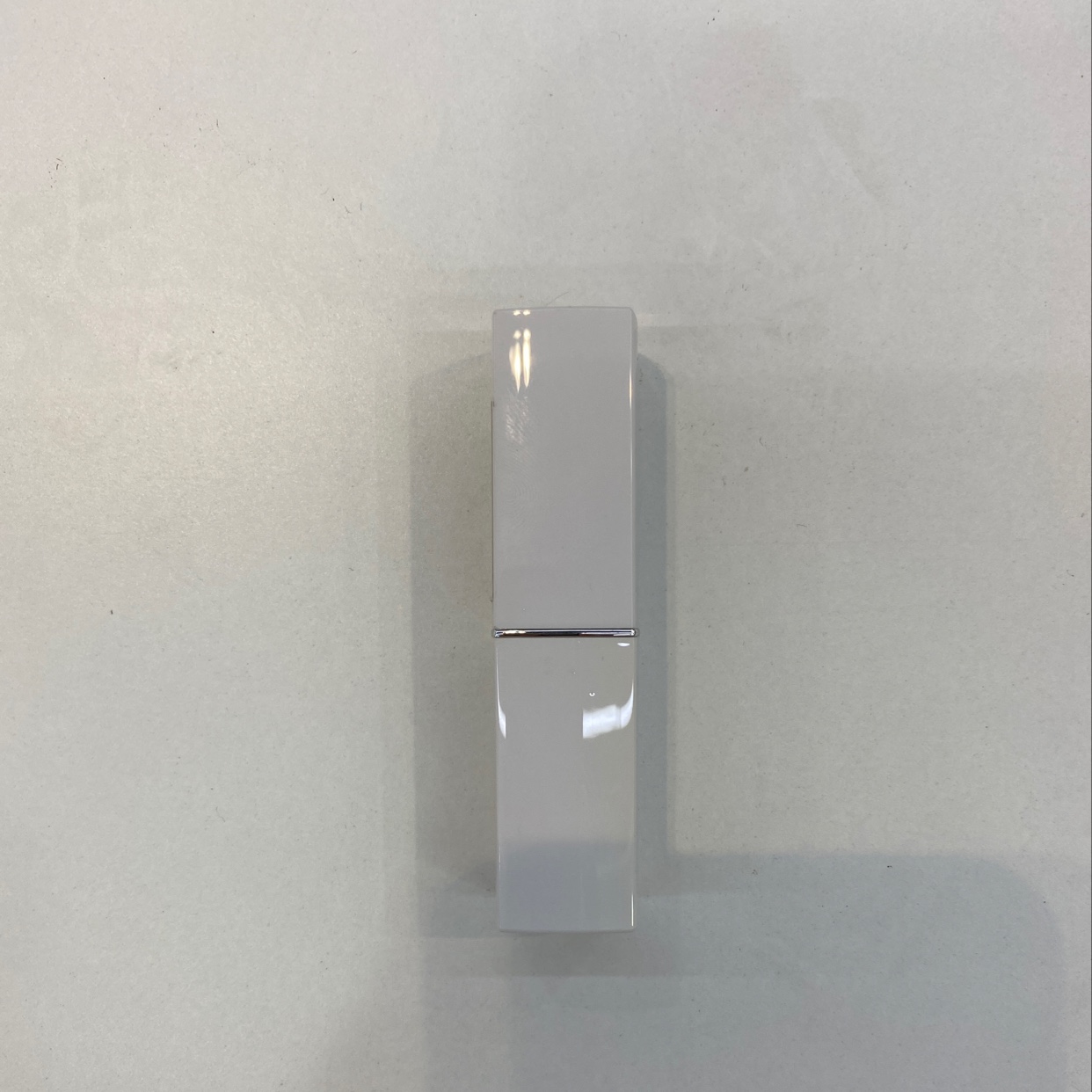 White square lipstick tube