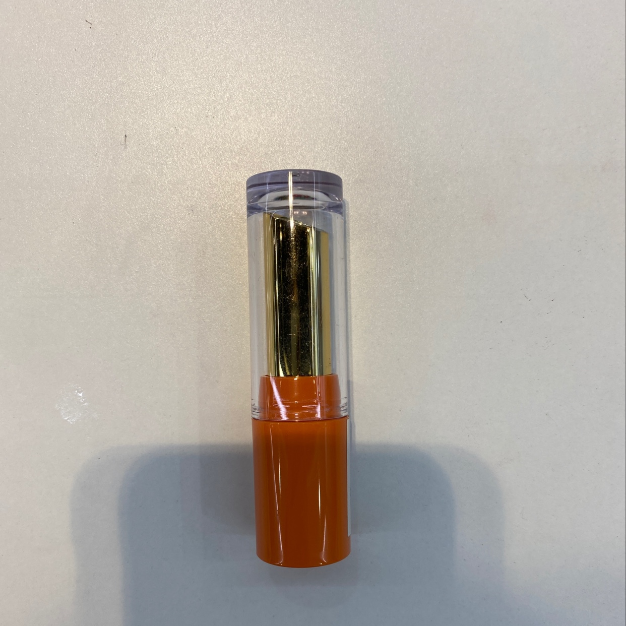Orange lipstick tube