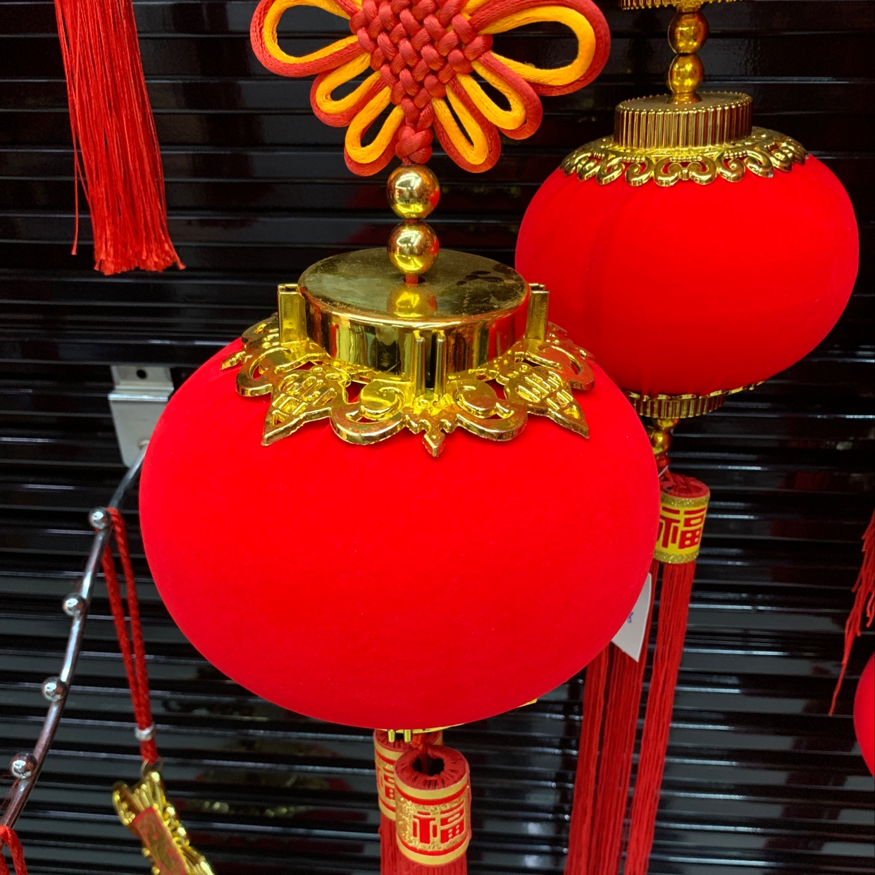 A new home is filled with red velvet lanterns and decorated with festive items for weddings and festivals