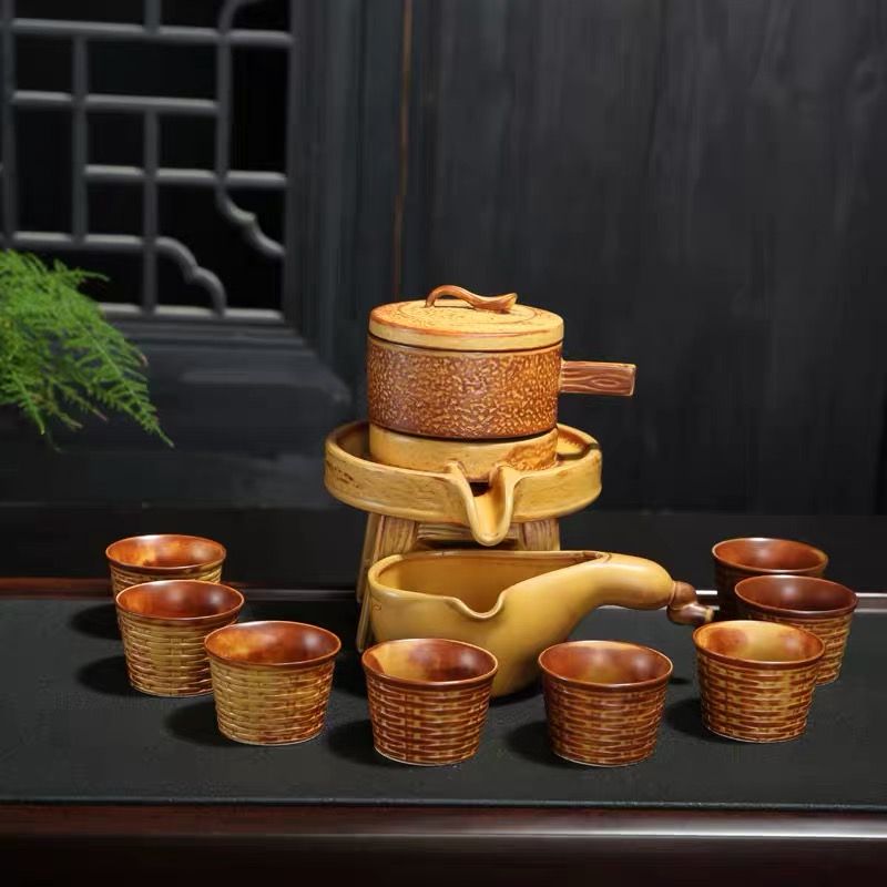 Lazy man semi-automatic tea set household retro personality anti-ironing stone mill automatic tea infuser