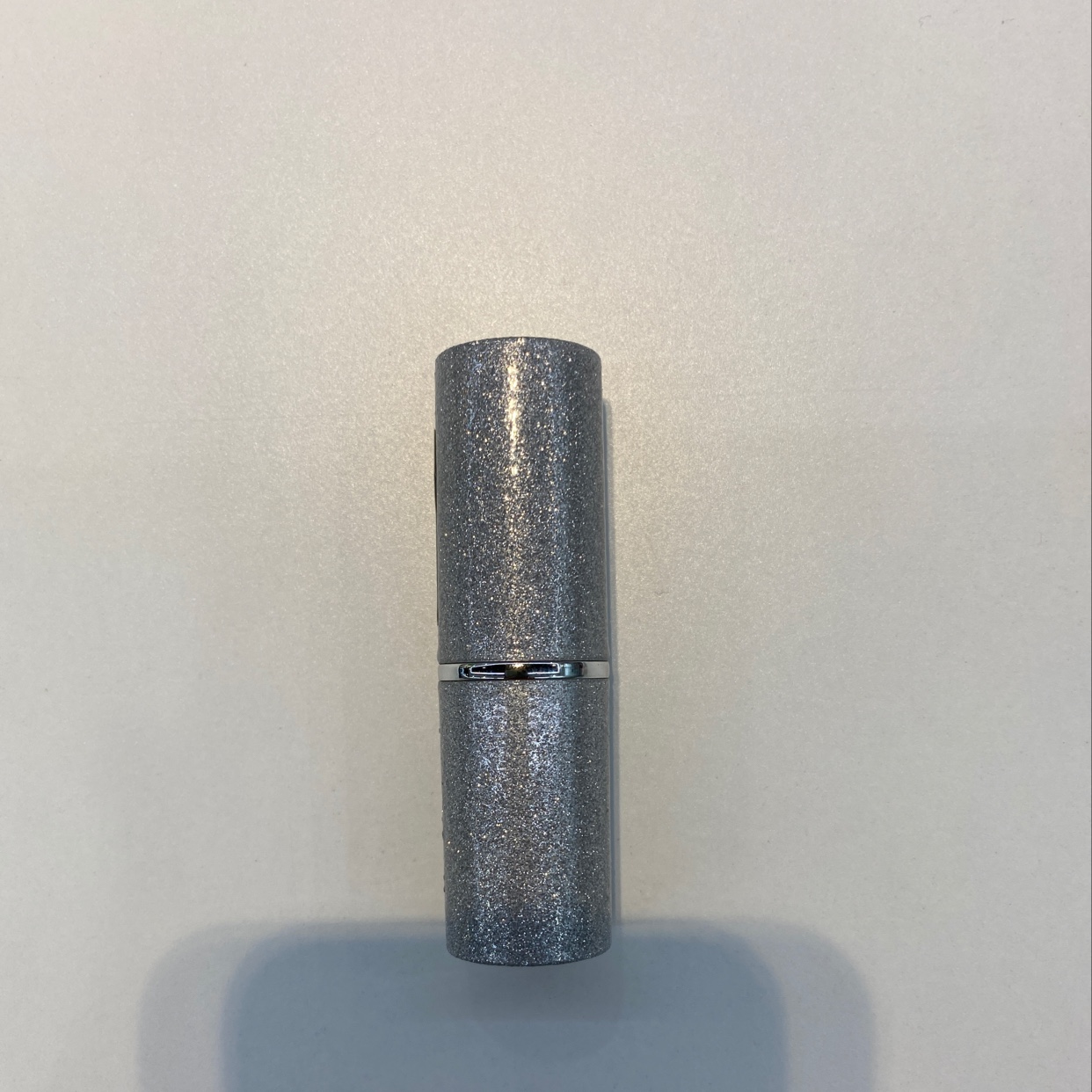 Bright silver lipstick tube
