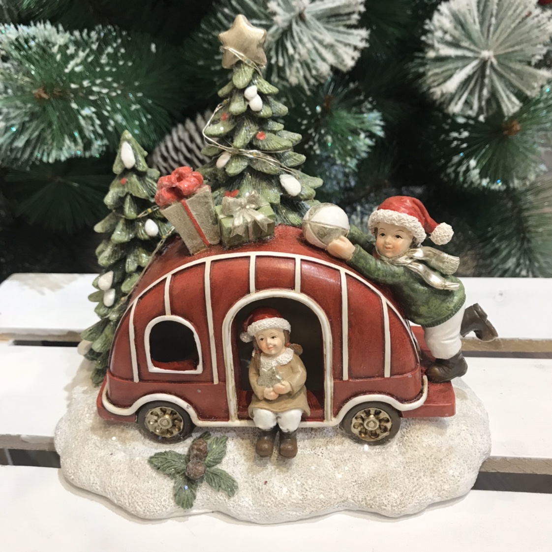 Christmas ornaments on a red car thumbnail