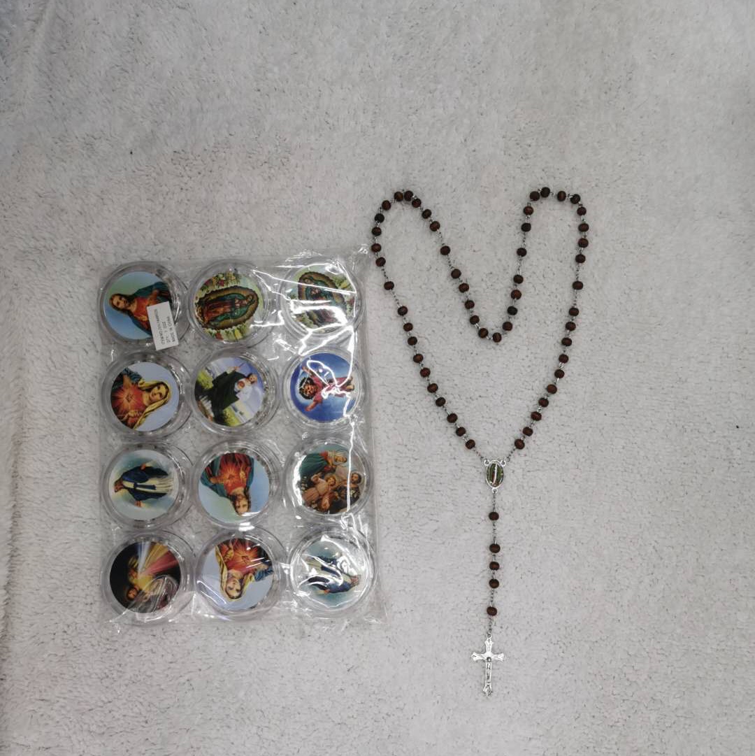 a necklace of wooden beads and curved needles thumbnail