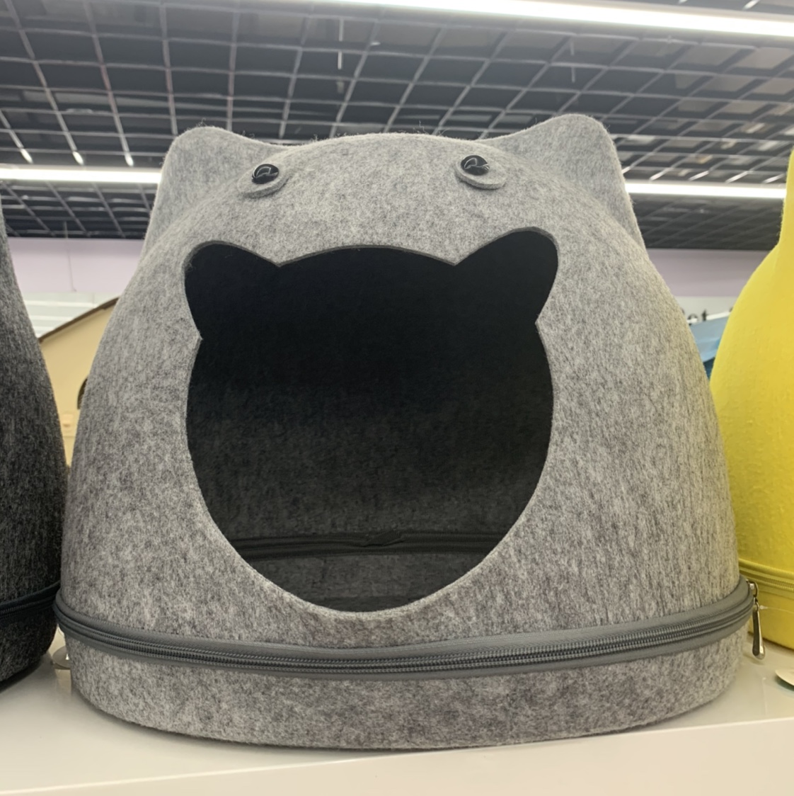 Grey cat-shaped open pet bed