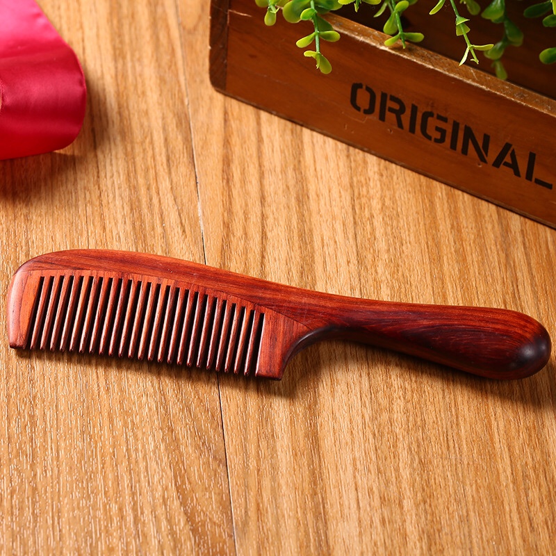 This high-end small-leaf rosewood comb with a thickened round handle offers an excellent feel. It is the top choice for a massage and straightening hair comb as a gift or for home use details Picture