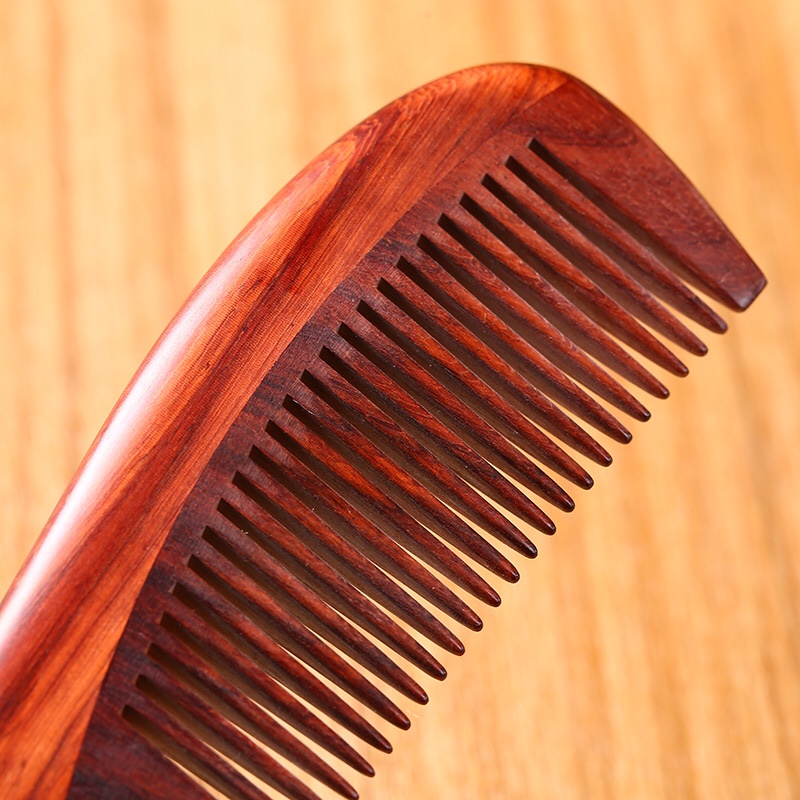 This high-end small-leaf rosewood comb with a thickened round handle offers an excellent feel. It is the top choice for a massage and straightening hair comb as a gift or for home use Application Scenario