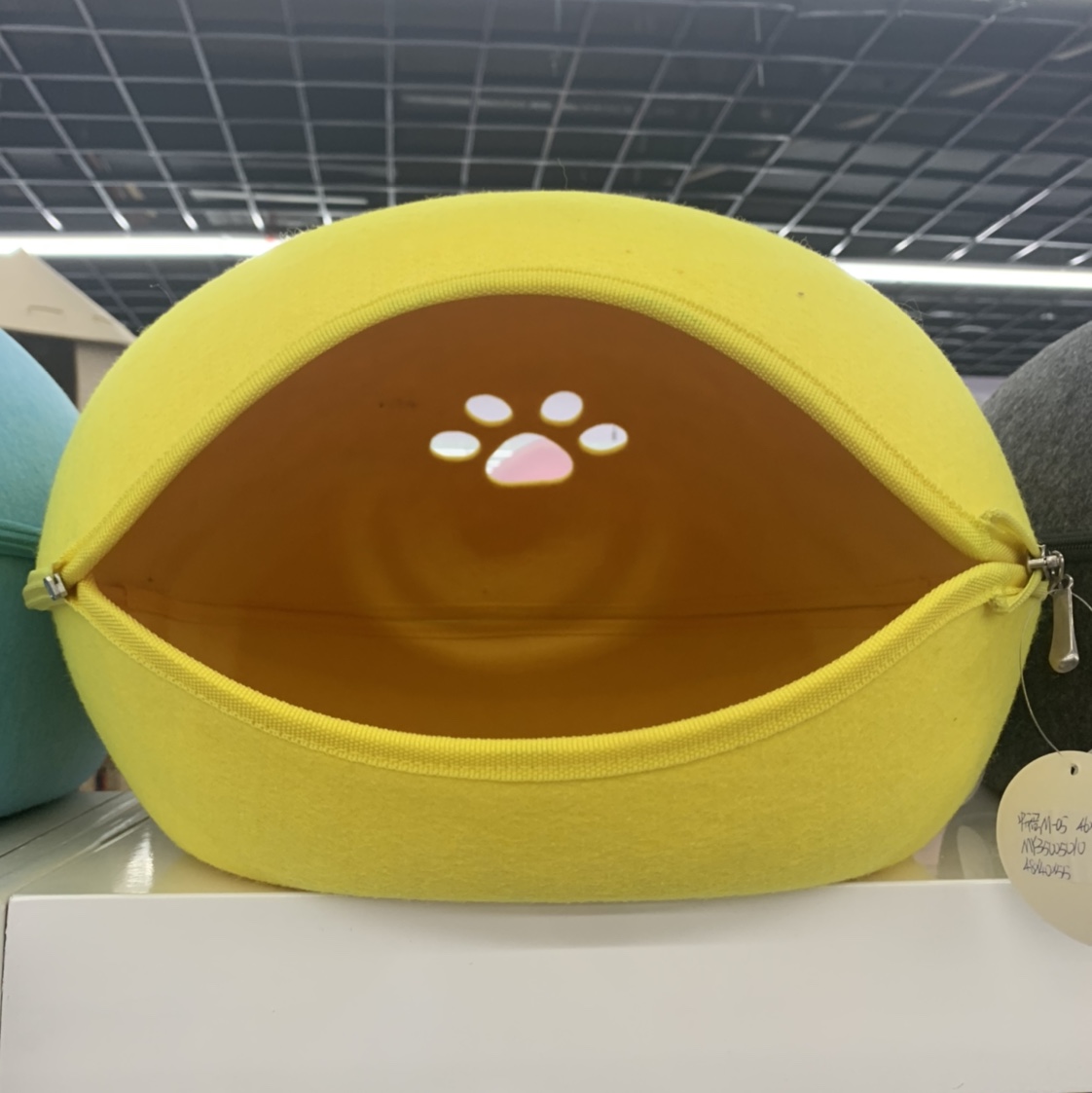 Yellow oval-shaped opening pet bed