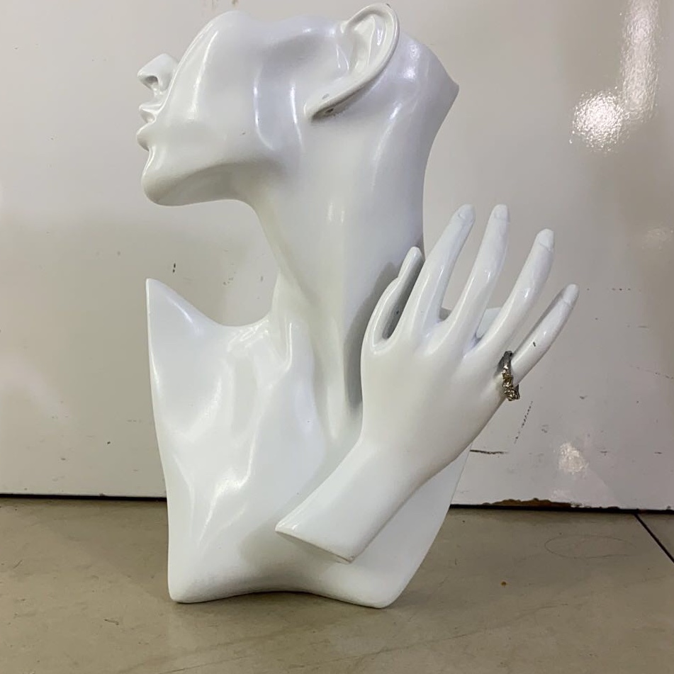 The resin avatar is white with a hand