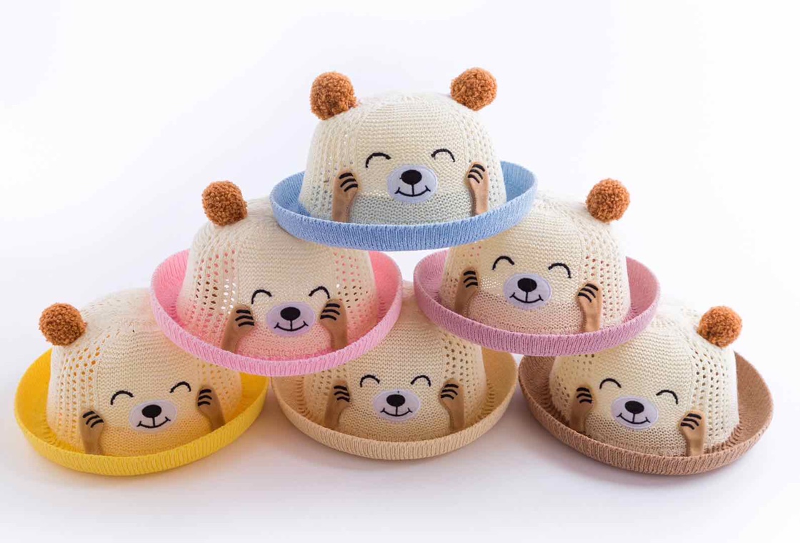 Boys and girls wearing straw hats for children