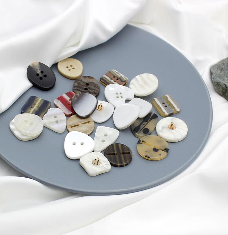 White two-eye resin buttons, irregular shirt buttons, irregular dress buttons, decorative buttons