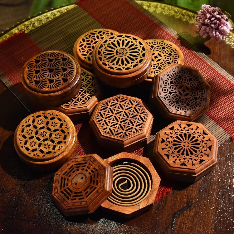 A round and flat incense burner made of rosewood