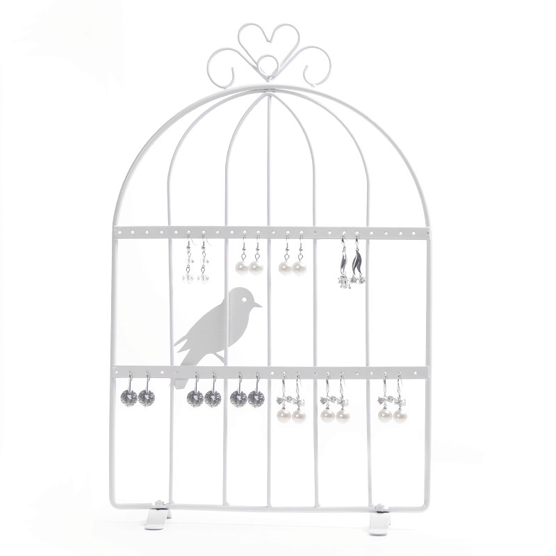 The iron birdcage is white