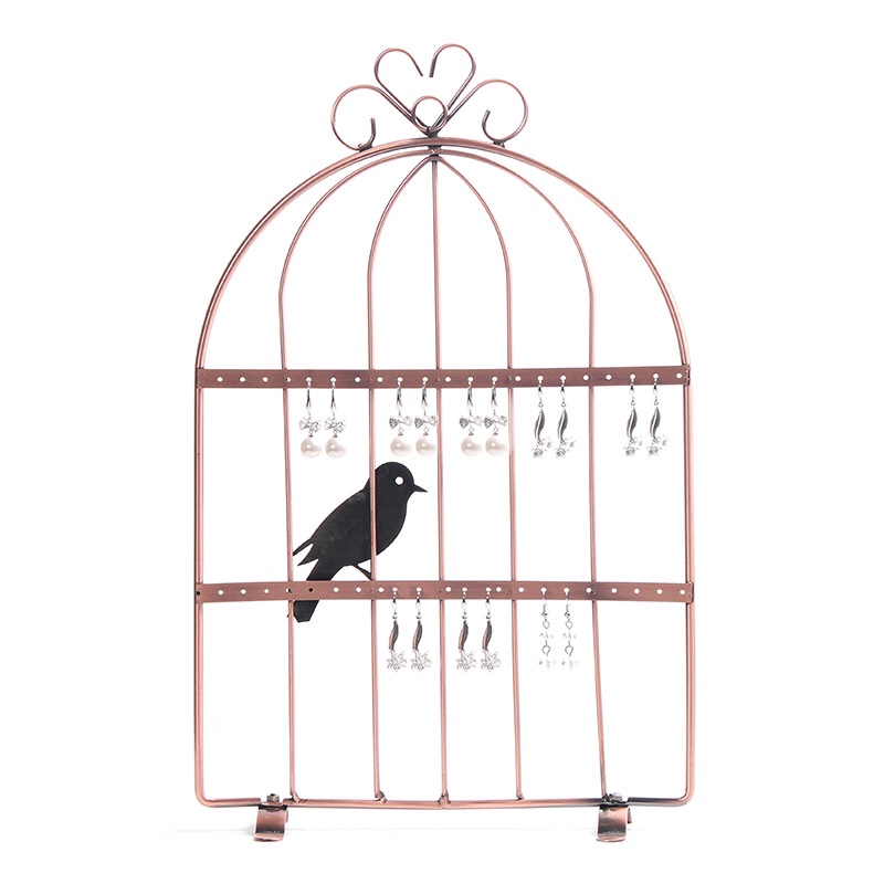 The iron birdcage is bronze in color