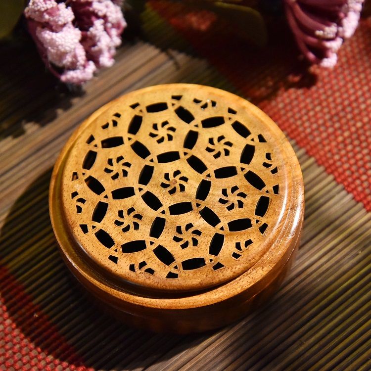 A round and flat incense burner made of rosewood detail image 3