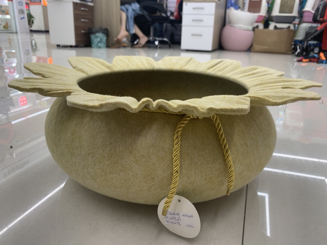 A large yellow round pet bed