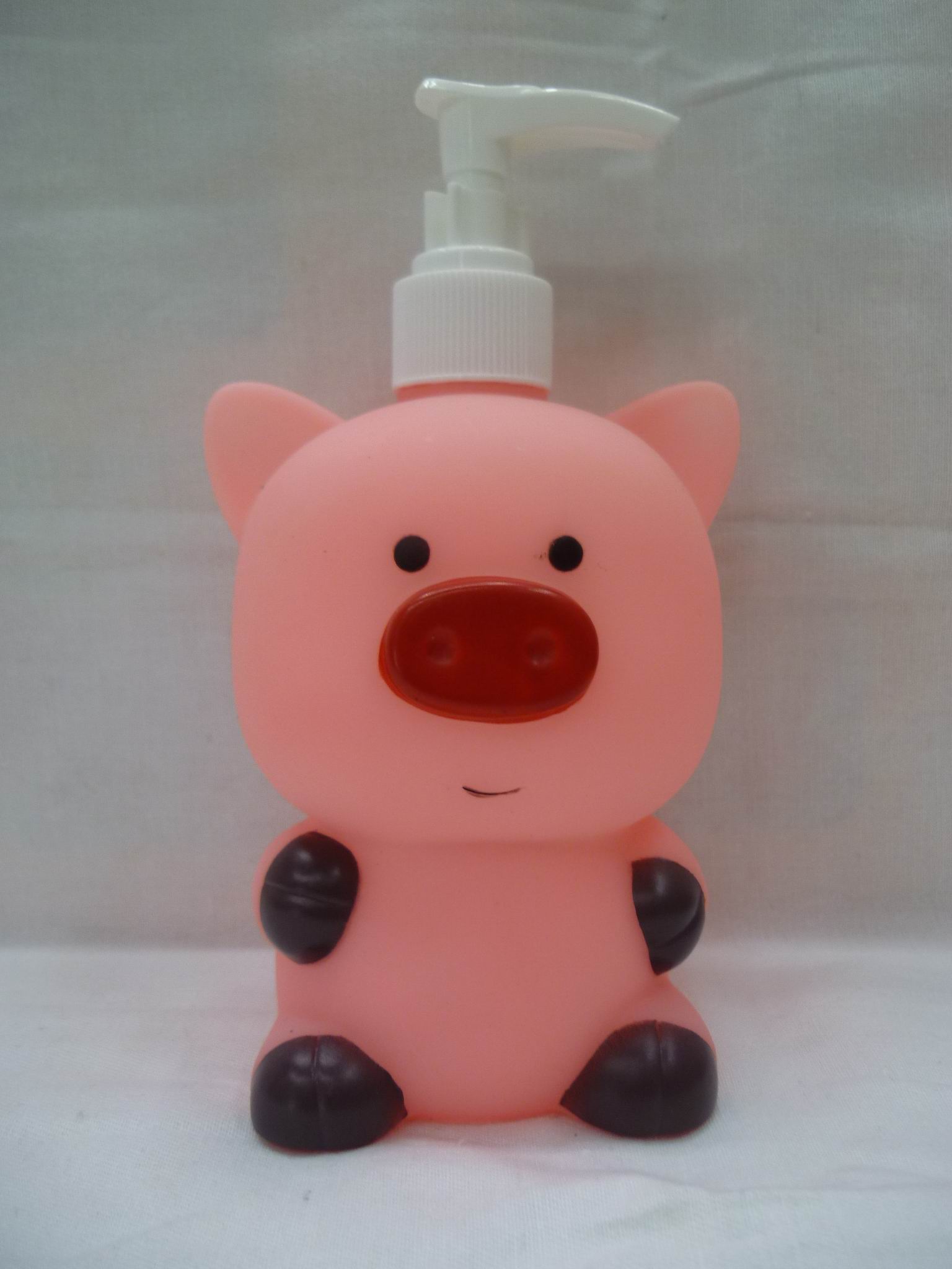 Bottle of hand sanitizer bottle of body wash bottle of pink pig
