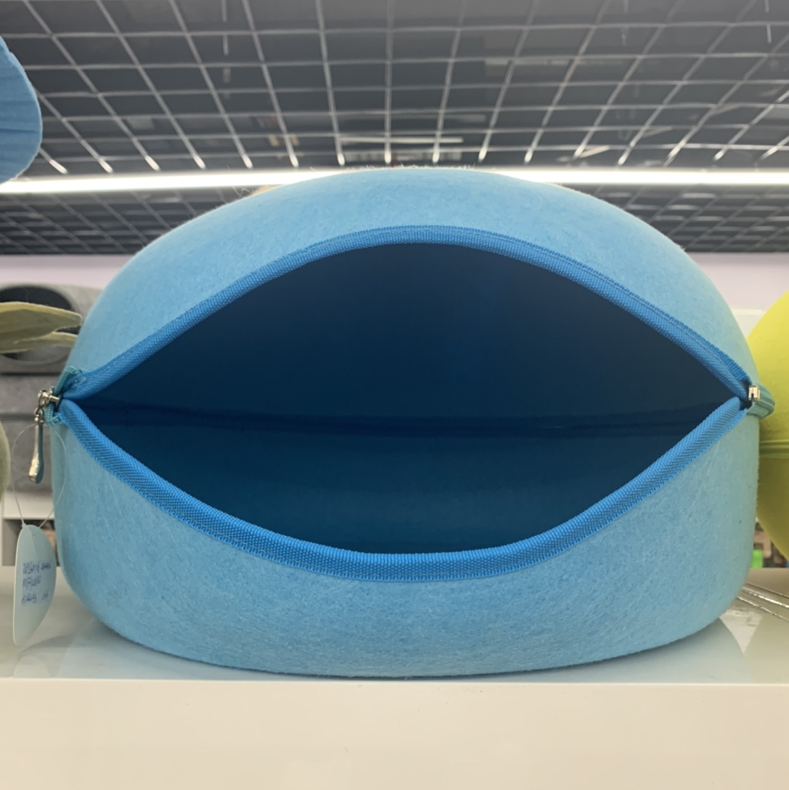 Blue oval-shaped opening pet bed