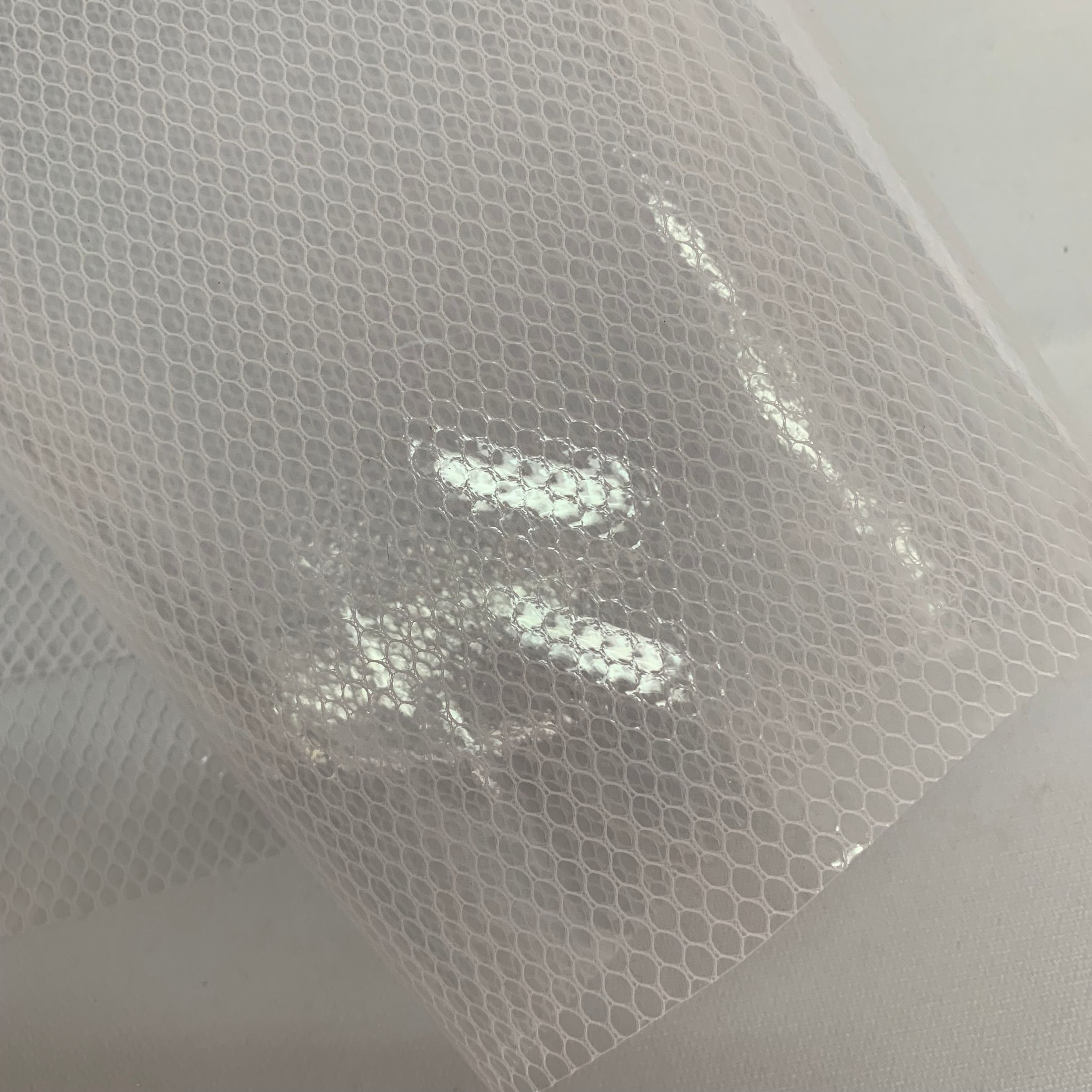 六角网环保EVA PEVA夹网布洗漱包材料膜详情图3