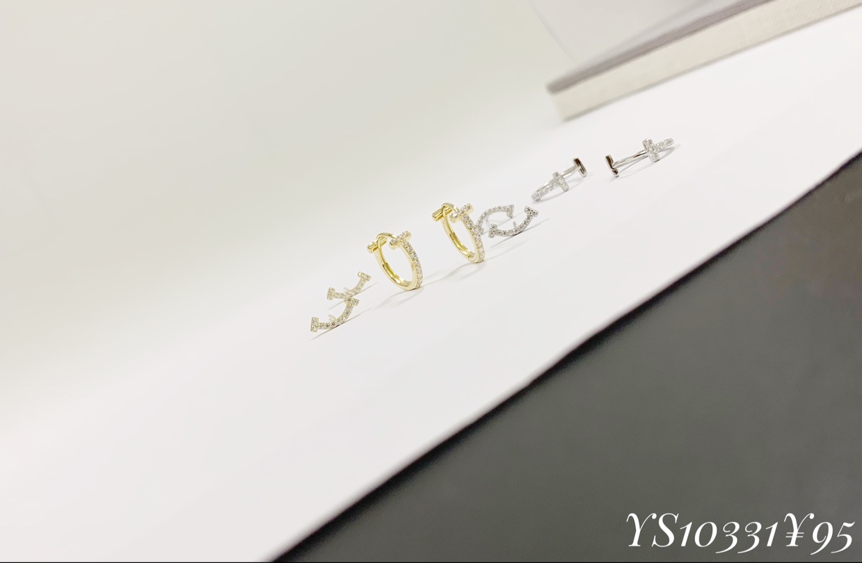 Slightly set smiling face earrings