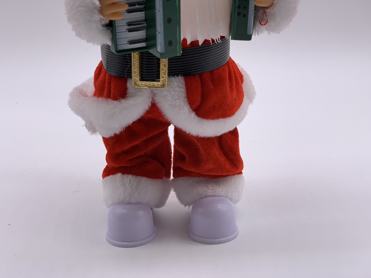 Santa Claus, 30 centimeters tall, holding an accordion undefined