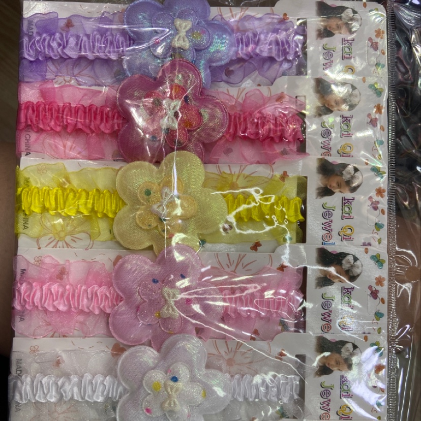 Children wear a plum headband