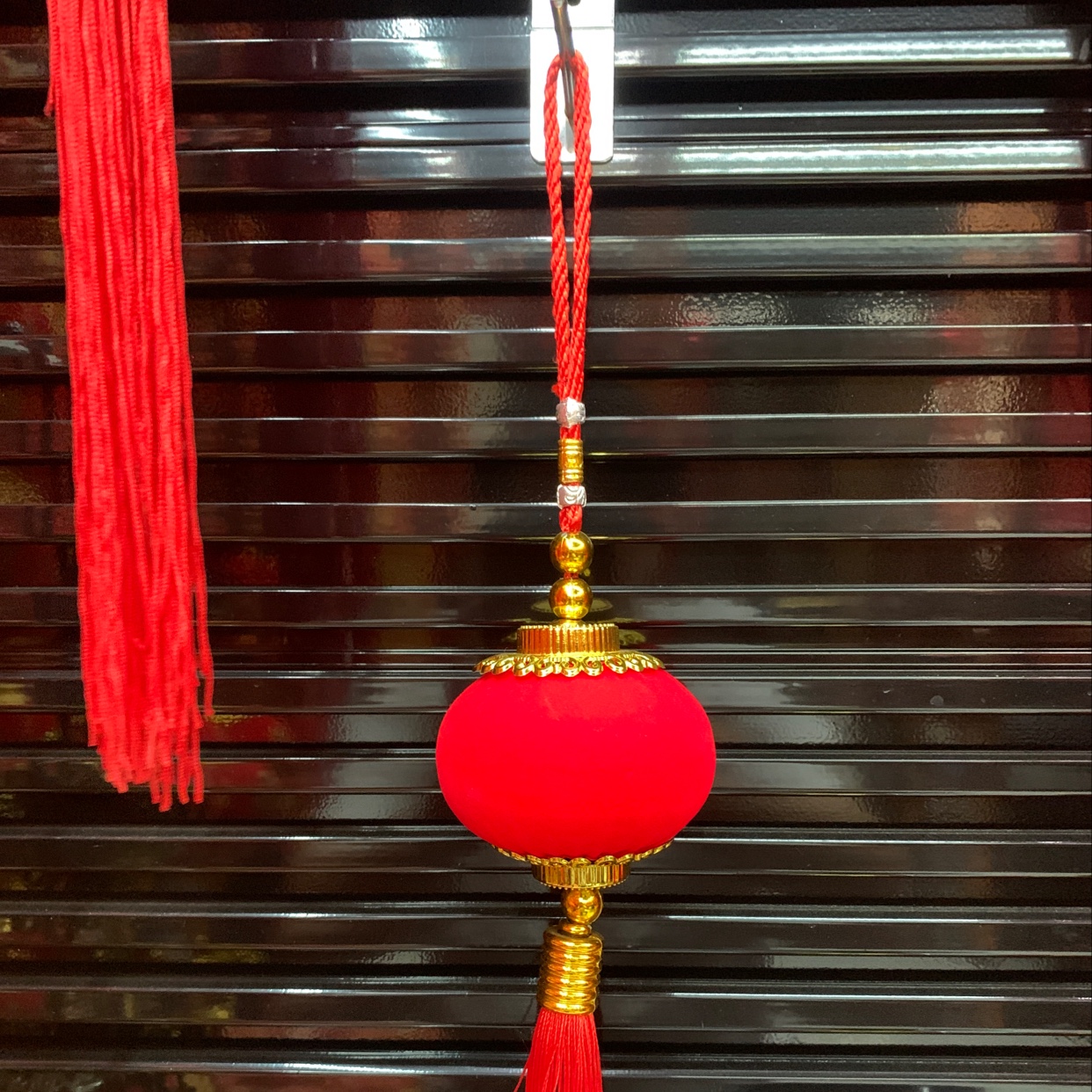 All red velvet fabric light cages, individual string lights, festive wedding and festival supplies for moving into a new home