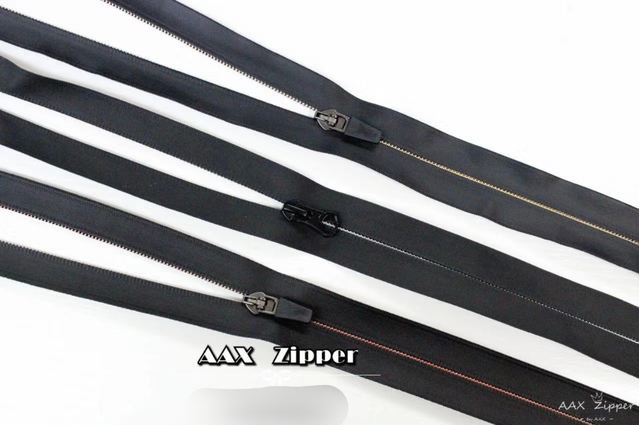 Nylon no. 5 waterproof zipper with gold and silver teeth exposed thumbnail