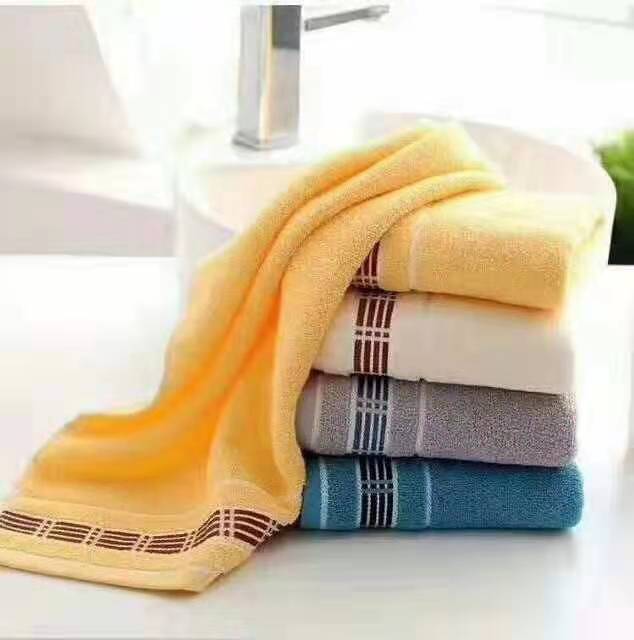 A bag of 35*75cm four-color cotton towels with vertical strips at the bottom can be mixed together