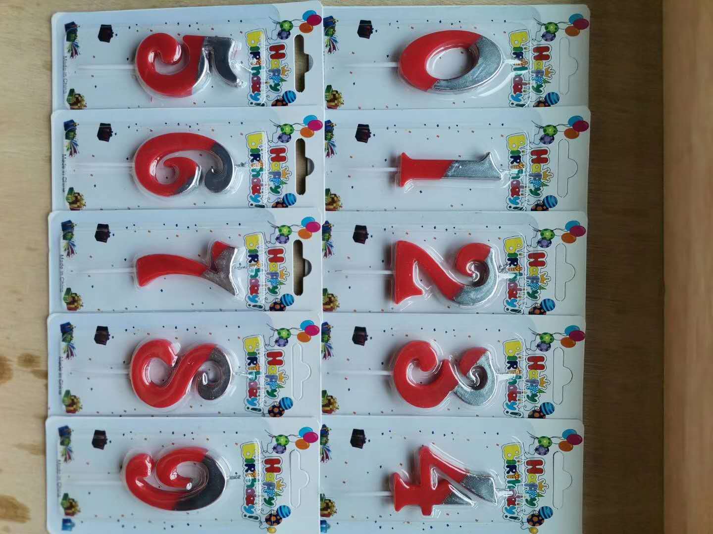 Upscale birthday cake decorated with red numbers full figure