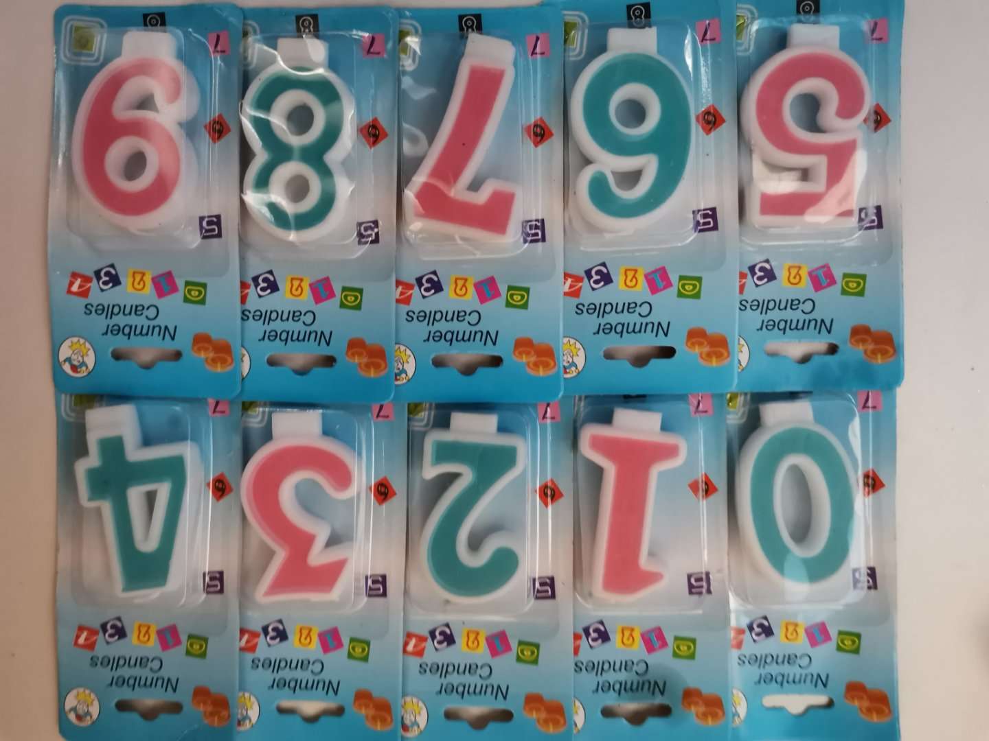 Upscale birthday cake decorated with red and green numbers full figure
