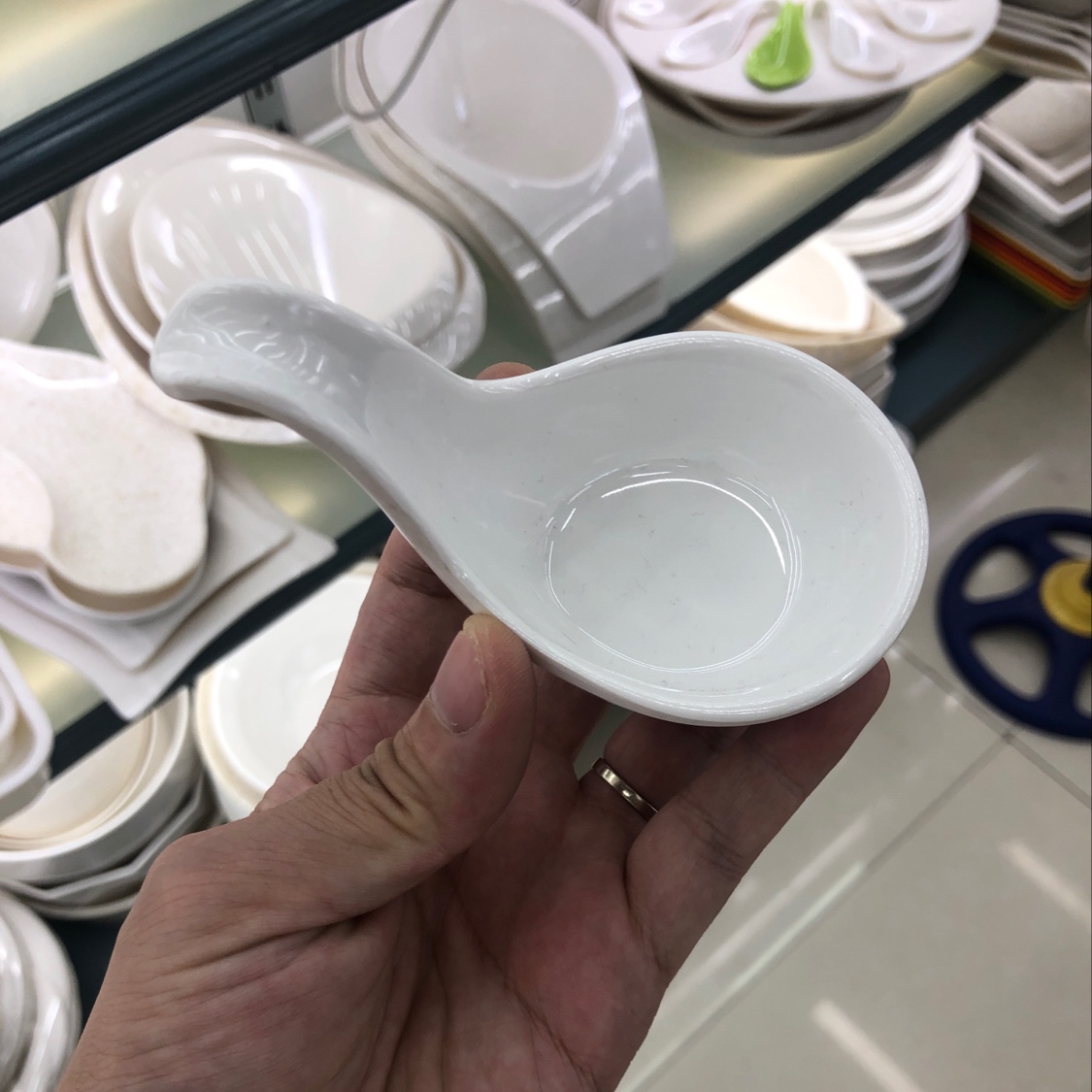 A small dish with a handle