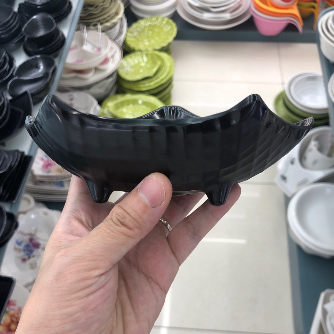 A small black irregular-shaped bowl details Picture