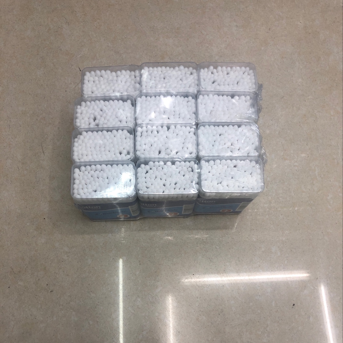 A cube box of cotton swabs