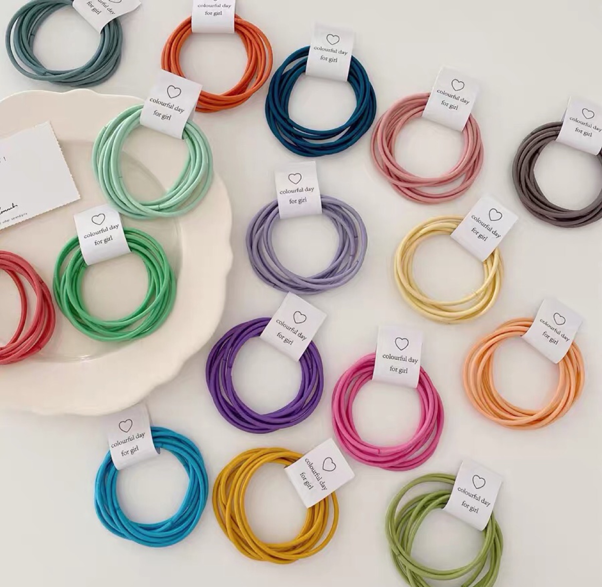 Five basic colored rubber bands, a rainbow-colored hair tie, and a fresh and cute hair band