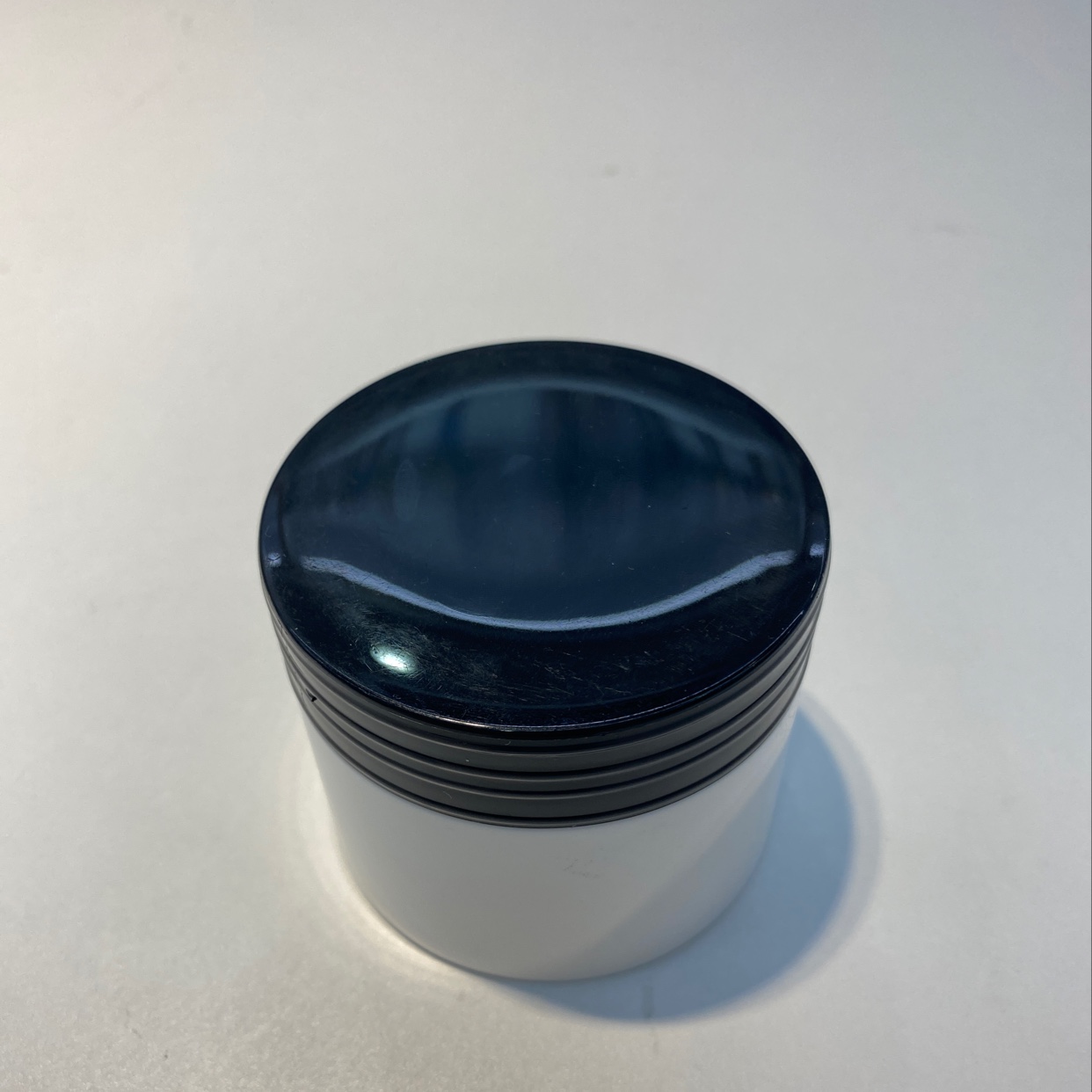 Black cream bottle