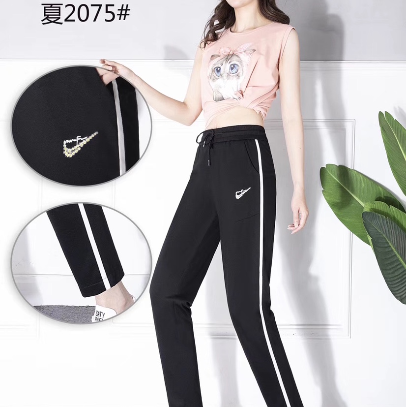 Pantalón con tiras laterales