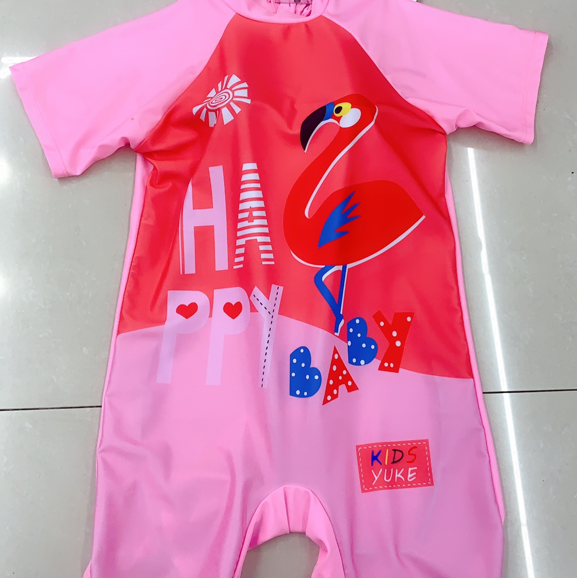 A girl's one-piece swimsuit with a hat thumbnail