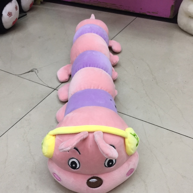 A caterpillar playing music on all sides