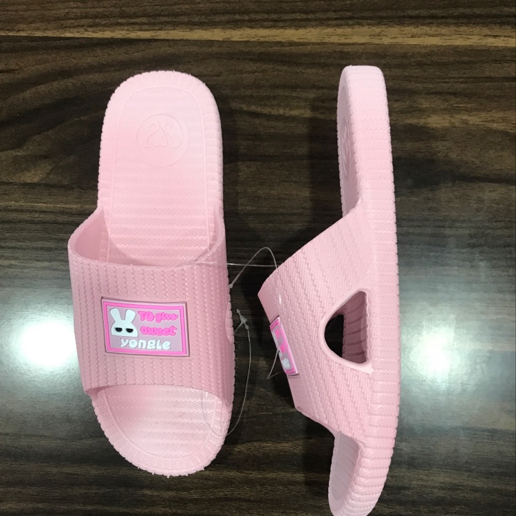 Little white rabbit in women's slippers details Picture