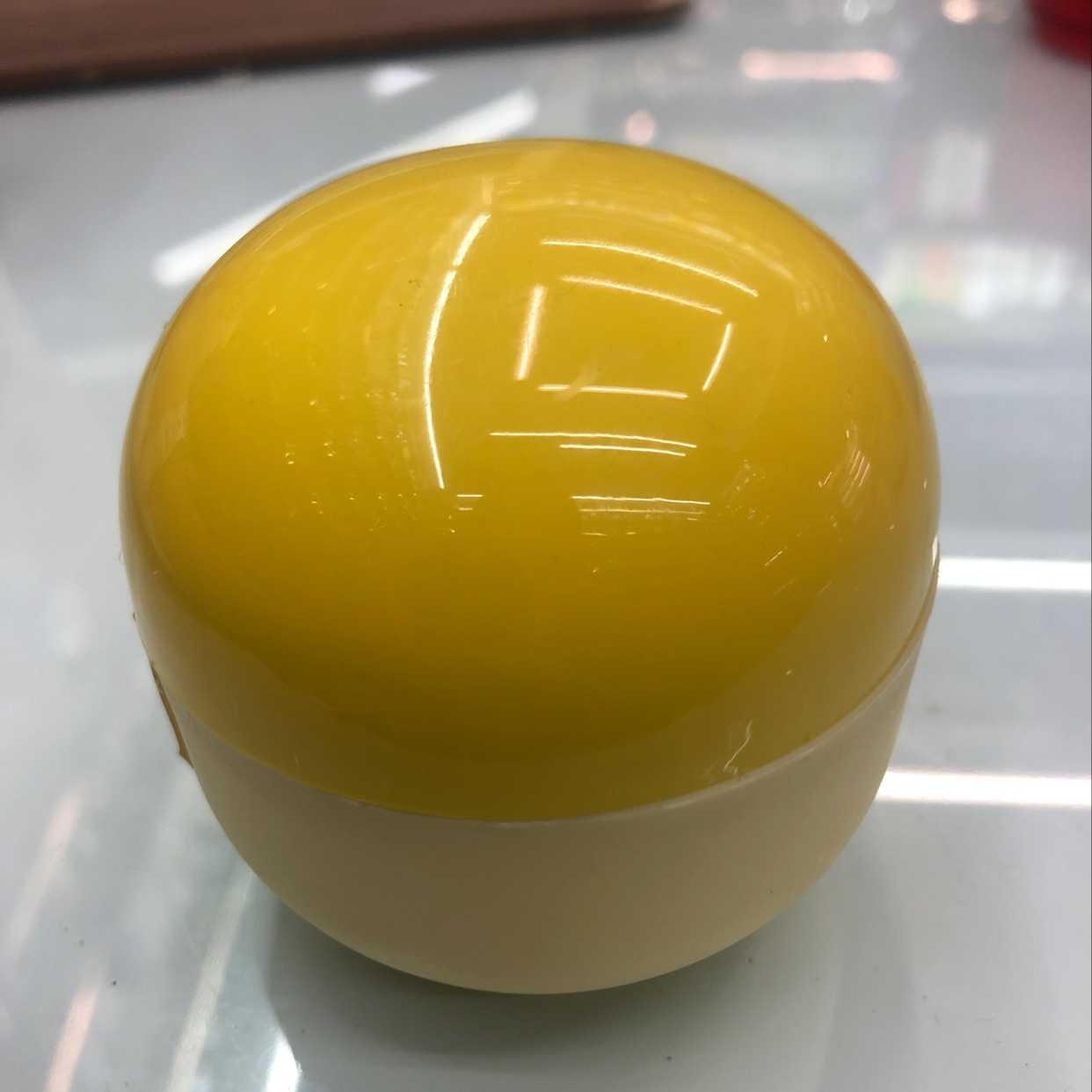 Yellow round cream bottle thumbnail