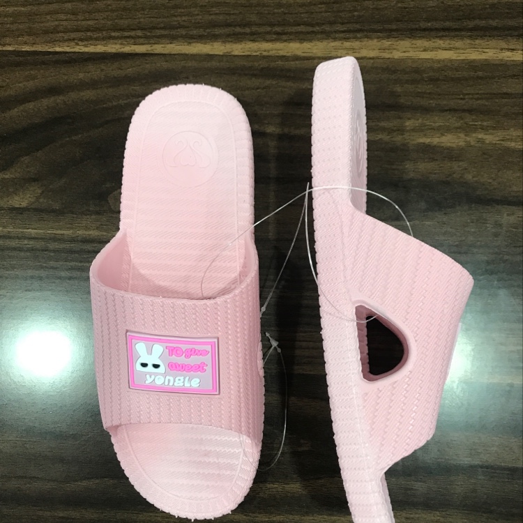 Little white rabbit in women's slippers Specification image